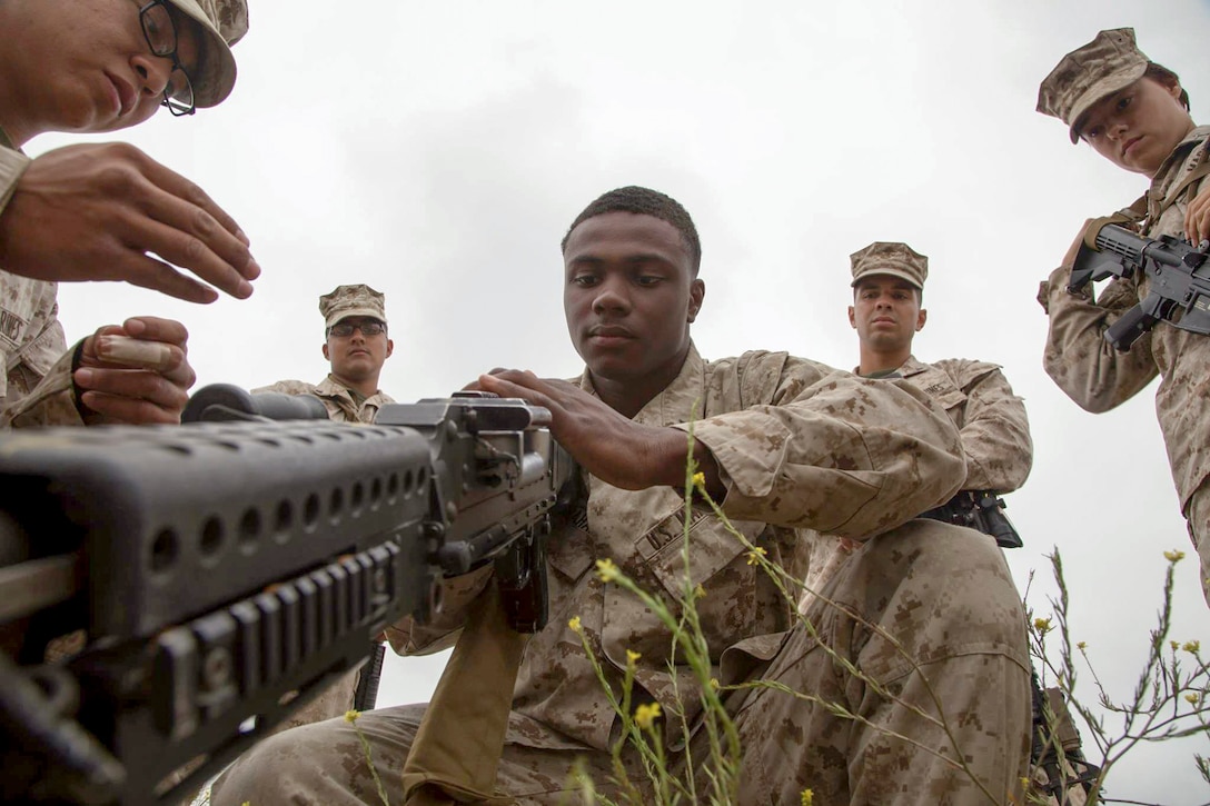 Lance Cpl. Trivelle Graham clears a simulated stoppage on an M240B machine gun before a live-fire exercise on a range at Marine Corps Base Camp Pendleton, Calif., May 10, 2016. The Marines participated in the event to better familiarize themselves with the weapons systems mounted on top of a truck. Marine Corps photo by Staff Sgt. Scott McAdam
