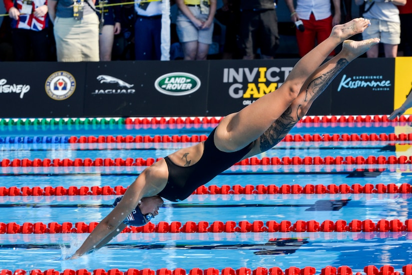 Army Sgt. Elizabeth Marks enters the water in the breaststroke finals at the 2016 Invictus Games in Orlando, Fla., May 11, 2016. Air Force photo by Senior Master Sgt. Kevin Wallace