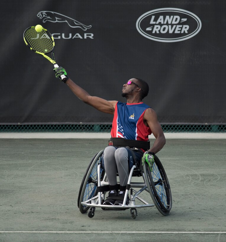 Army veteran R.J. Anderson serves a ball against an opponent from New Zealand in the wheelchair tennis semifinals at the 2016 Invictus Games in Orlando, Fla., May 11, 2016. DoD photo by Roger Wollenberg