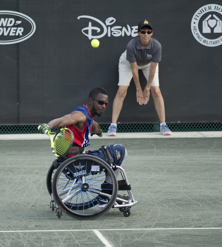 Army veteran R.J. Anderson hits a backhand shot in the wheelchair tennis semifinals during the 2016 Invictus Games in Orlando, Fla., May 11, 2016. DoD photo by Roger Wollenberg