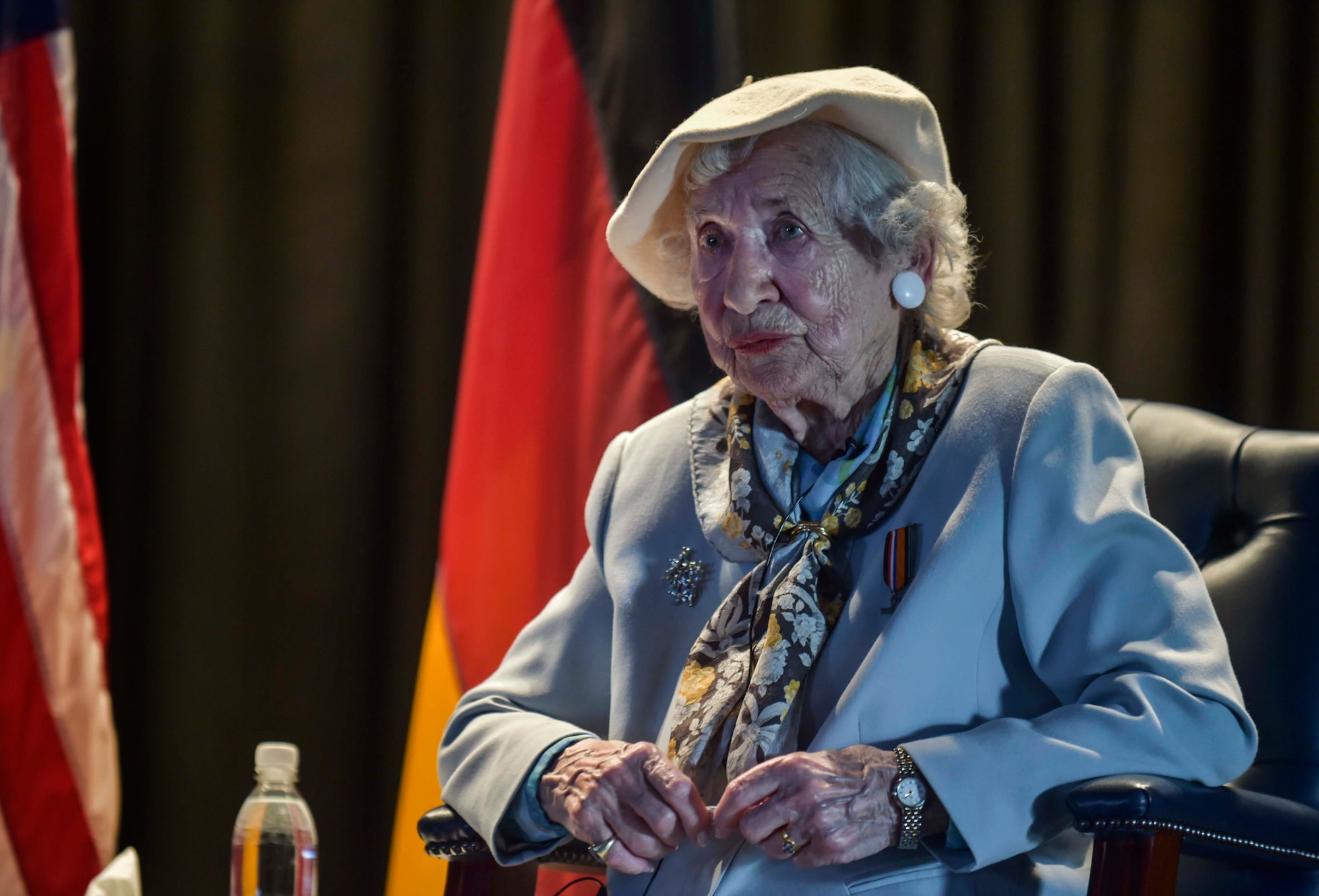 Ms. Selma Van de Perre, 92-year-old Holocaust survivor, speaks to Airmen and their families during a Holocaust remembrance event held at Ramstein Air Base, Germany, May 6, 2016. Hundreds of people attended the event where Van de Perre told her story of how she was a part of the resistance movement against  the Nazis during World War II and ultimately survived a concentration camp. (U.S. Air Force photo/Tech Sgt. Sara Keller) 