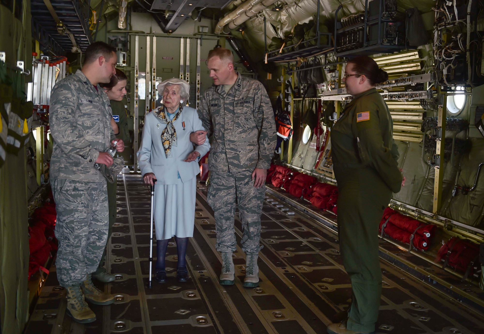 Ms. Selma Van de Perre, 92-year-old Holocaust survivor, tours the inside of C-130J Super Hercules at Ramstein Air Base, Germany, May 6, 2016. Van de Perre, took a  tour of the base after she told her story of survival during the 2016 Holocaust remembrance event. (U.S. Air Force photo/Tech Sgt. Sara Keller) 