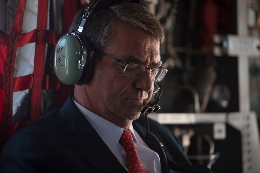 Defense Secretary Ash Carter listens to radio traffic aboard a CH-47 Chinook helicopter as he travels to the U.S. Air Force Academy after visiting Schriever Air Force Base, Colo., May 12, 2016. DoD photo by Air Force Senior Master Sgt. Adrian Cadiz