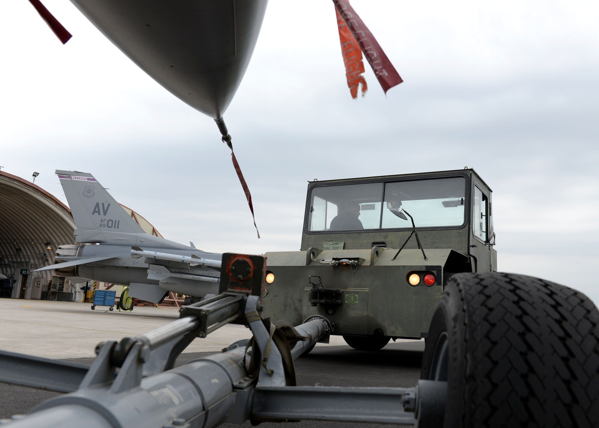Staff Sgt. Anthony Hodges, 31st Aircraft Maintenance Squadron dedicated crew chief, tows an F-16 Fighting Falcon into position, May 11, 2016, at Aviano Air Base, Italy. Dedicated Crew Chiefs ensure all maintenance is properly performed to their assigned aircraft. (U.S. Air Force photo by Airman 1st Class Cary Smith/Released)
