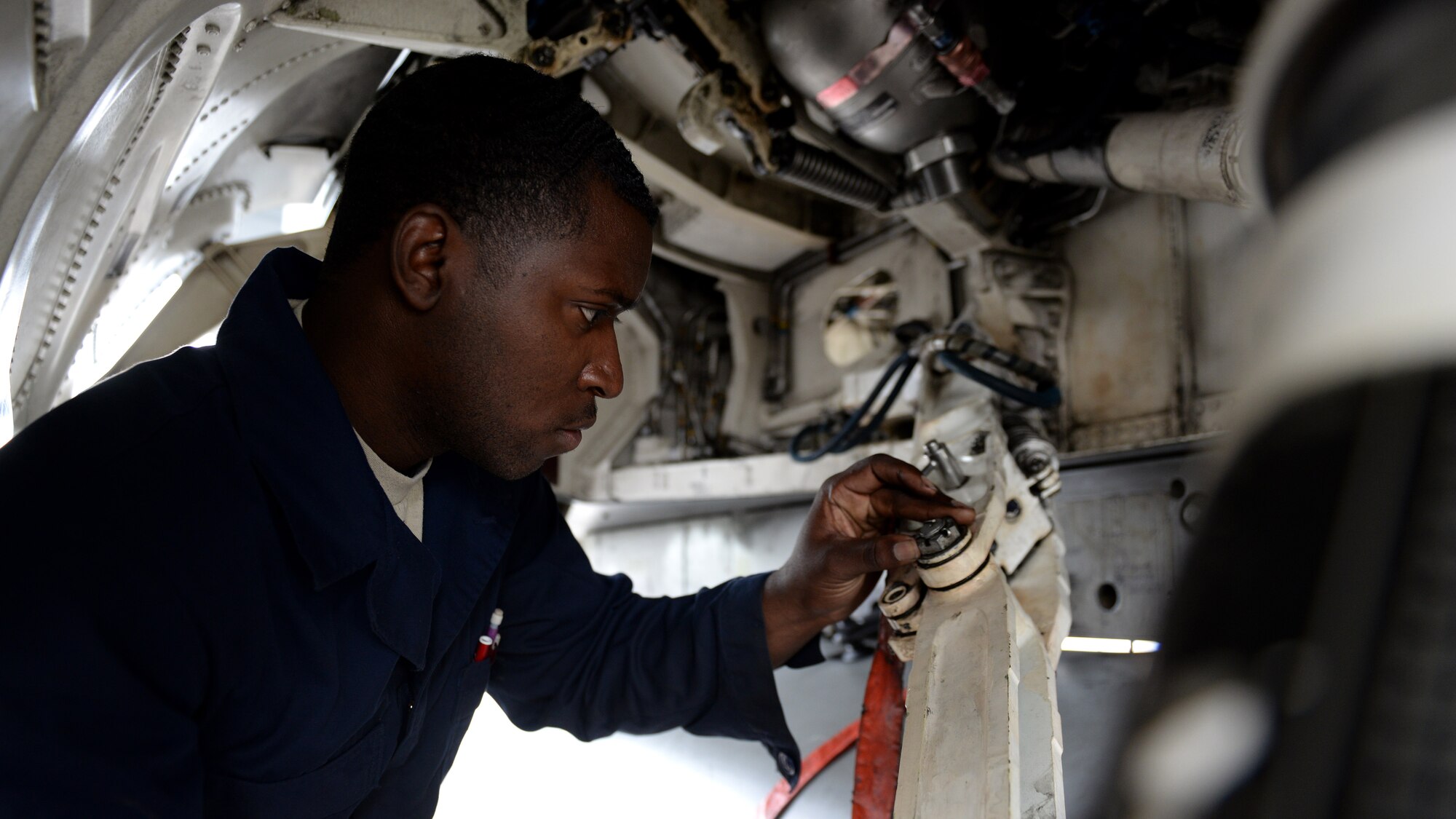 Staff Sgt. Anthony Hodges, 31st Aircraft Maintenance Squadron dedicated crew chief, performs pre-flight checks on an F-16 Fighting Falcon, May 11, 2016, at Aviano Air Base, Italy. Dedicated Crew Chiefs are the last ones to touch the aircraft before flight and the first when it lands. (U.S. Air Force photo by Airman 1st Class Cary Smith/Released)
