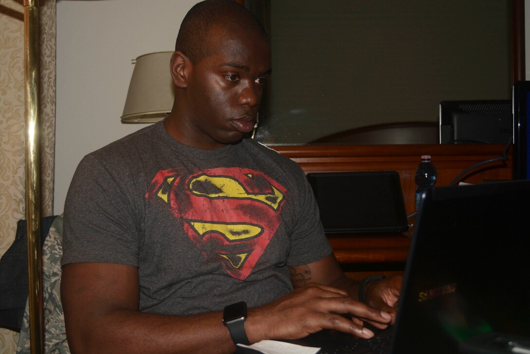 Tech. Sgt. William Jacobs, special handling supervisor with the 71st Aerial Port Squadron, works on his Ph.D program’s final project after his duty day in Sacile, Italy, May 5, 2016. Jacobs is participating in proficiency enhancement training at the 724th Air Mobility Squadron's small air terminal Aviano Air Base, Italy, during his unit’s annual training. (U.S. Air Force photo/Staff Sgt. Joe Yanik)