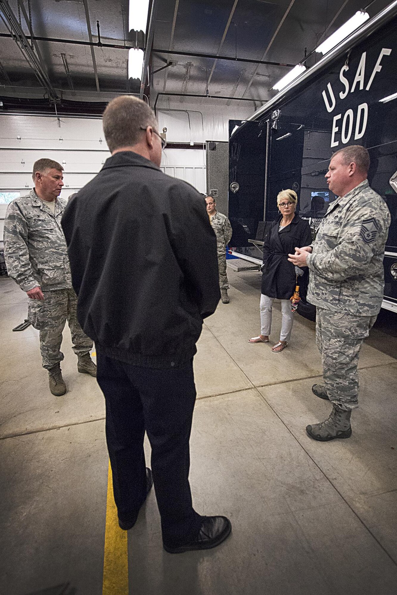 Col. Doug Schwartz, 434th Air Refueling Wing commander, left, and Senior Master Sgt. Scott Fleek 434th Civil Engineer Squadron explosive ordnance disposal flight chief, right, talk to Christy Householder, Cass County economic development agency and 434th Operations Support Squadron honorary commander, and Chris Betzner, Peru fire chief and 434th CES honorary commander, during a tour of a new EOD facility at Grissom Air Reserve Base, Indiana May 9, 2016. The new facility will allow for enhanced training, storage and function for the EOD unit. (U.S. Air Force photo/Douglas Hays)