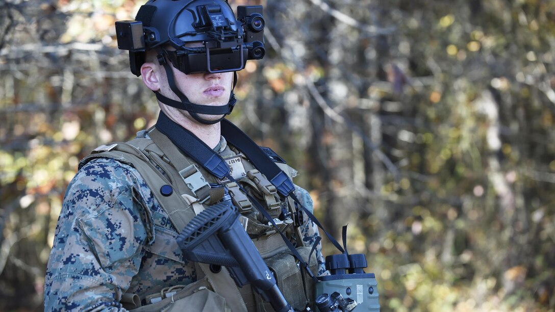 A student in the Marine Corps infantry officer course uses the Office of Naval Research-funded Augmented Immersive Team Trainer during testing held at Marine Corps Base Quantico, Va., Nov. 5, 2015. The AITT allows Marines to transform any location into a dynamic training ground by injecting virtual images, indirect fire effects, aircraft, vehicles, simulated people, etc. onto a real-world view of one's surroundings. 