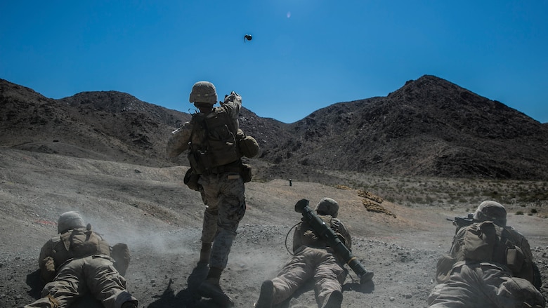 Sgt. Kyle Kimbriel, squad leader, 2nd Battalion, 8th Marine Regiment, throws an M67 hand grenade to clear out targets on at Range 410 while participating in Integrated Training Exercise 3-16 at Marine Corps Air Ground Combat Center, Twentynine Palms, California, May 9, 2016. 2/8 came from Marine Corps Base Camp Lejeune, North Carolina, to participate in ITX 3-16. (Official Marine Corps photo by Lance Cpl. Dave Flores/Released)