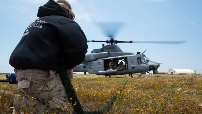 Capt. Bryan Mcdonald, a firepower control team leader with 1st Air Naval Gunfire Liaison Company, adjusts a fast rope during rope suspension techniques training on Marine Corps Base Camp Pendleton May 9, 2016. HRST techniques allow Marines to insert or extract from areas that normally would be inaccessible through normal means of transportation. 