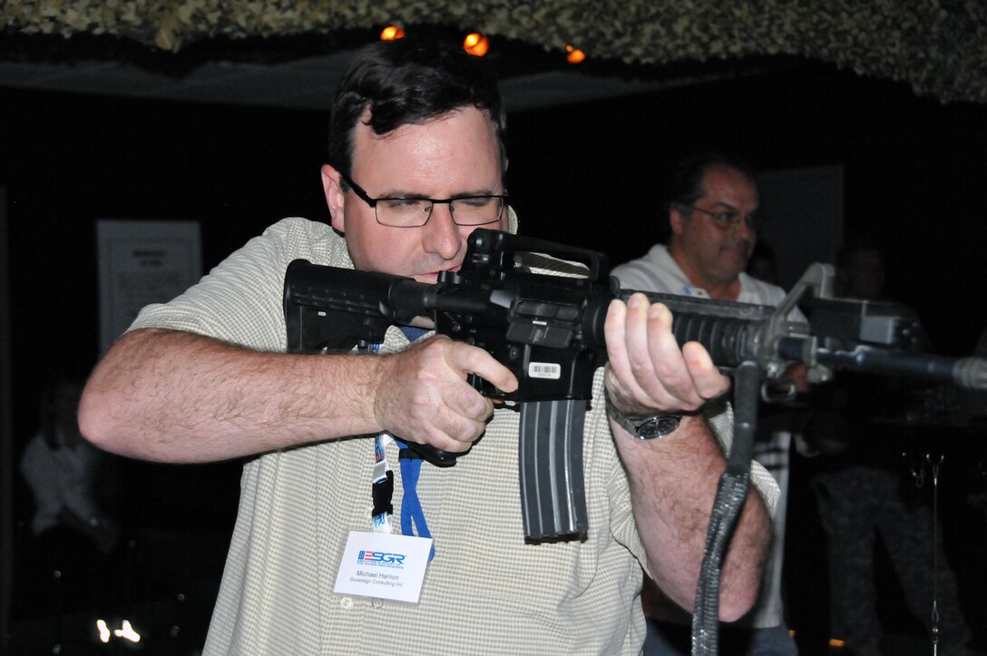 Michael Hanlon, director of operations at Sovereign Consulting, participates in the Engagement Skills Trainer May 12 during an Employer Support of the Guard and Reserve (ESGR) visit to the U.S. Army Reserve's 99th Regional Support Command at Joint Base McGuire-Dix-Lakehurst, New Jersey. ESGR is a Department of Defense partnership program.