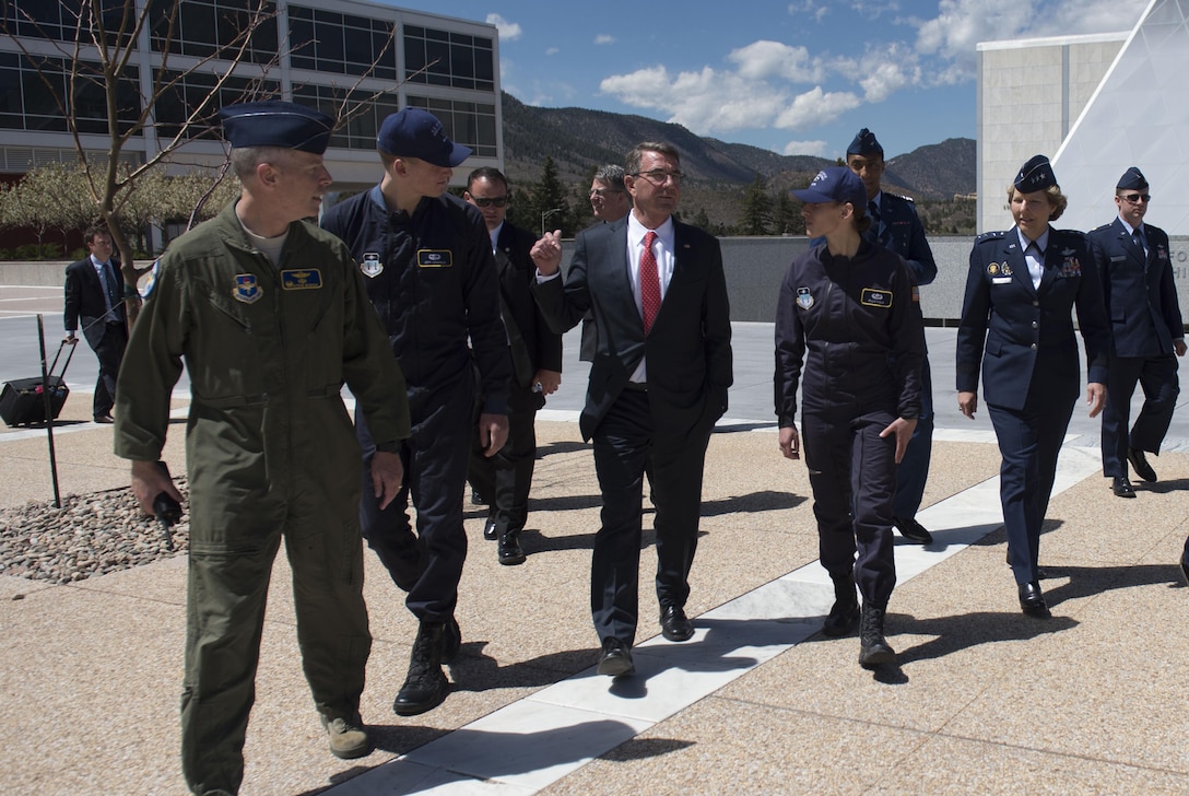 Defense Secretary Ash Carter, center, walks with U.S. Air Force Academy parachute team cadets as he tours the campus in Colorado Springs, Colo., May 12, 2016. DoD photo by Air Force Senior Master Sgt. Adrian Cadiz