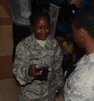 Senior Airman Courtney Jackson, 71st Aerial Port Squadron, checks identification of all passengers and visitors entering the passenger terminal as part of random anti-terrorism measures at Aviano Air Base, Italy, May 11, 2016. Jackson is a load planner at her home station, Joint Base Langley-Eustis, Va., and is cross training during her unit’s proficiency-enhancing tour in Italy. (U.S. Air Force photo/Staff Sgt. Joe Yanik)