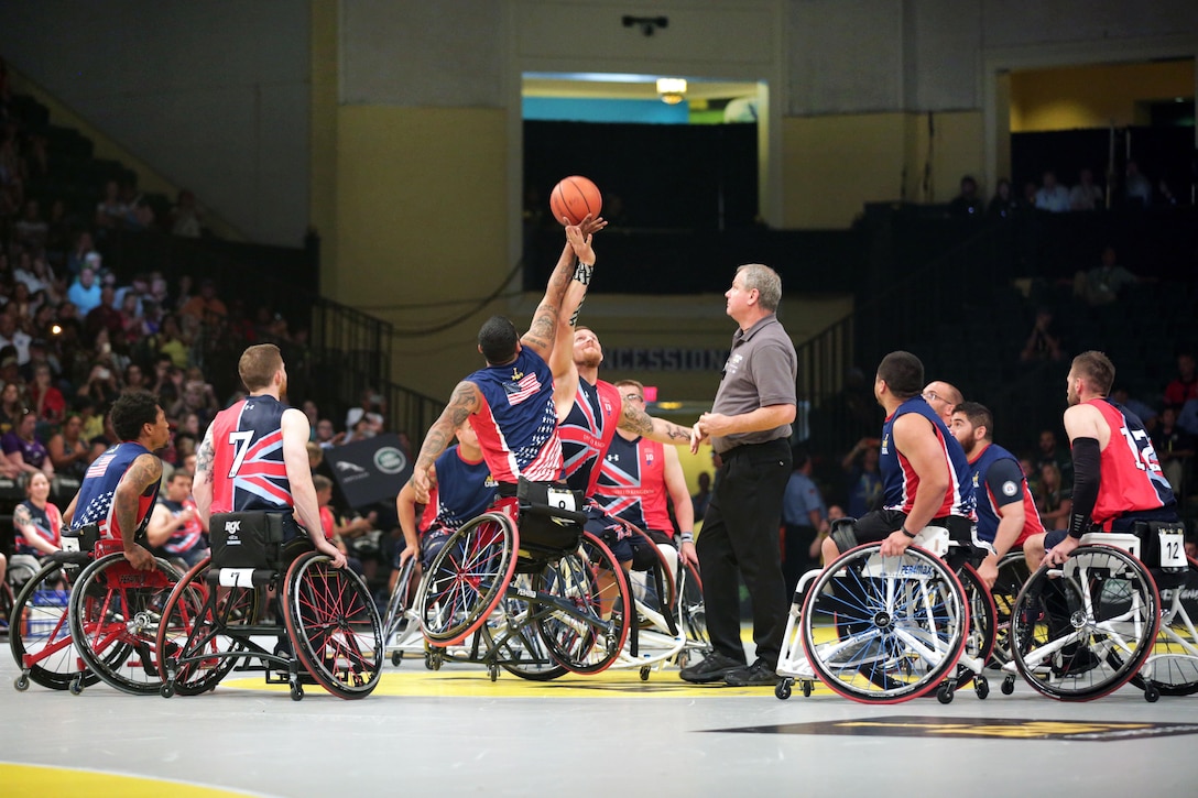 Marine Corps veteran Jorge Salazar, center left, wins the tipoff during the gold medal wheelchair basketball match at the 2016 Invictus Games in Orlando, Fla., May 12, 2016. The U.S. team went on to win the match. Army photo by Sgt. Jason Edwards