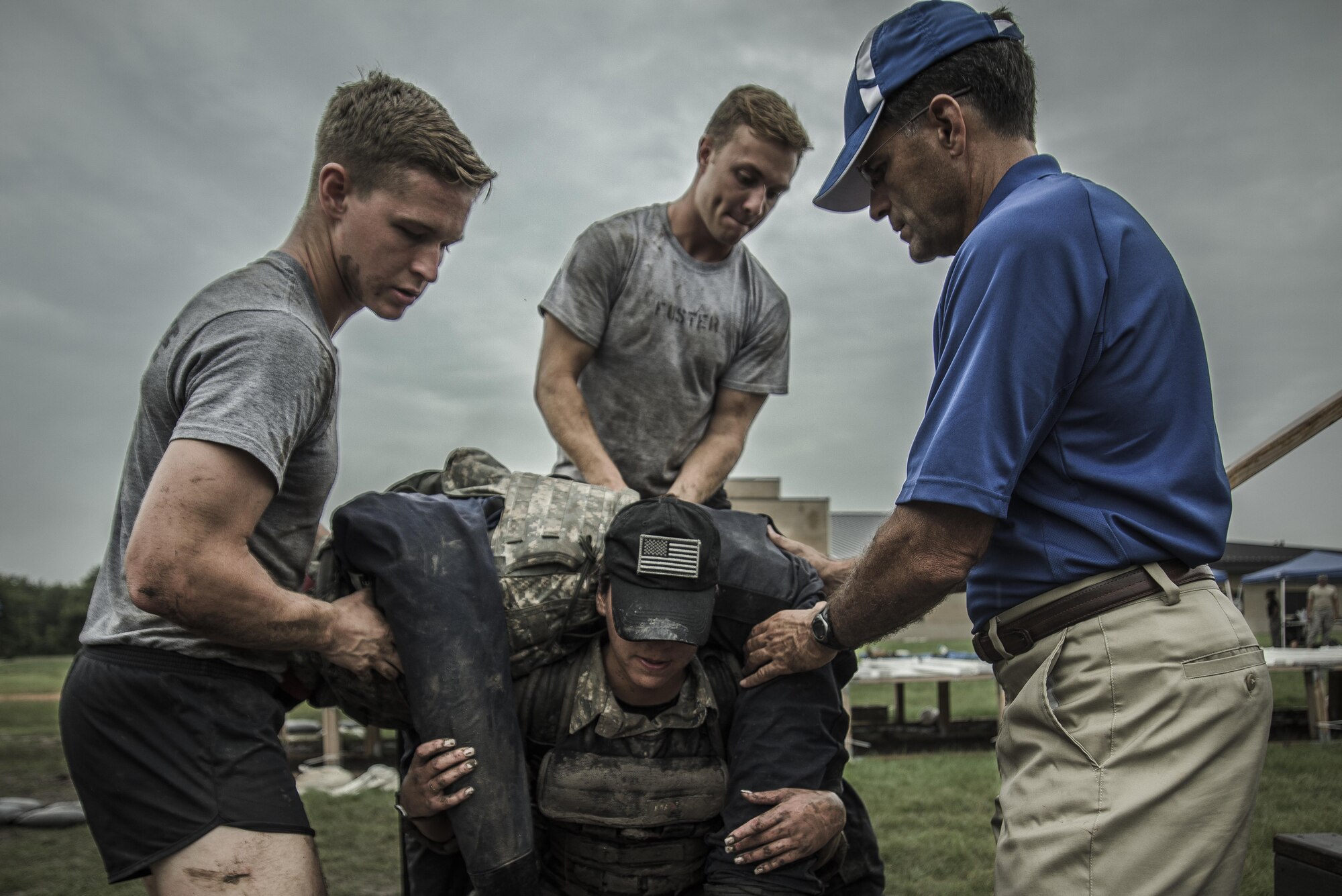 A female subject wears a 20-pound vest and 50-pound rucksack while lifting a 185-pound simulated casualty, June 19, 2015, as Dr. Baumgartner (right) and researchers from the Air Force Fitness Testing and Standards Unit ensure her safety. Air Education and Training Command’s Battlefield Airmen Physical Fitness Study Team and three individuals took home top Air Force level awards in the 2016 Air Force Analysis Awards competition. (U.S. Air Force Photo by Capt. Jose R. Davis)
