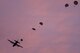 Marines jump from an Air Force C-130 Hercules at Yokota Air Base, Japan, May 11, 2016, during Jump Week. The Marines were from the 3rd Reconnaissance Battalion, 3rd Marine Division, III Marine Expeditionary Force and the C-130 was assigned to the 36th Airlift Squadron at Yokota AB. The training not only allowed the Marines to practice jumping, but it also allowed the Yokota aircrews to practice flight tactics and timed-package drops. (U.S. Air Force photo/Yasuo Osakabe)