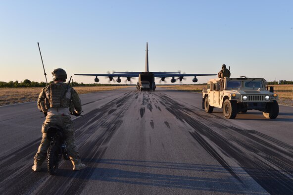 Airmen transport simulated patients to a MC-130J Commando II at Eglin Range, Fla., May 4, 2016, during exercise Emerald Warrior 16. Emerald Warrior is a U.S. Special Operations Command-sponsored mission rehearsal exercise during which joint special operations forces train to respond to real and emerging worldwide threats. (U.S. Air Force photo/Senior Airman Logan Carlson)