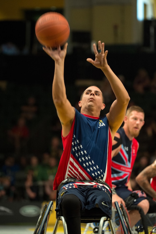 Navy veteran Javier Rodriguez takes a free throw against Great Britain during the wheelchair basketball gold medal match at the 2016 Invictus Games in Orlando, Fla., May 12, 2016. DoD photo by E. Joseph Hersom