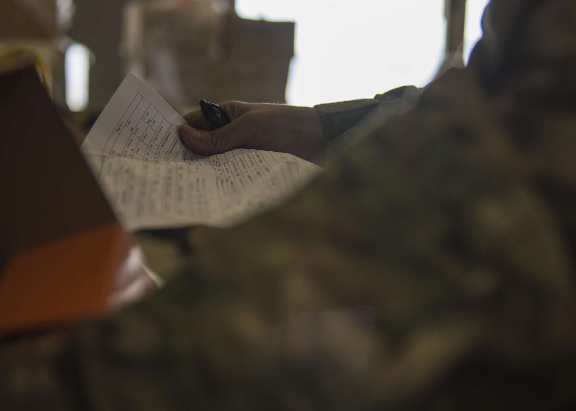 Senior Airman Michael Montalyo, 455th Expeditionary Logistics Readiness Squadron Traffic Management Office, checks the content of cargo at Bagram Airfield, Afghanistan, May 13, 2016. Members of the 455th ELRS traffic management inbound office take in and process all the cargo that comes to Afghanistan to be forwarded to other bases in the area of operation. (U.S. Air Force photo by Senior Airman Justyn M. Freeman)