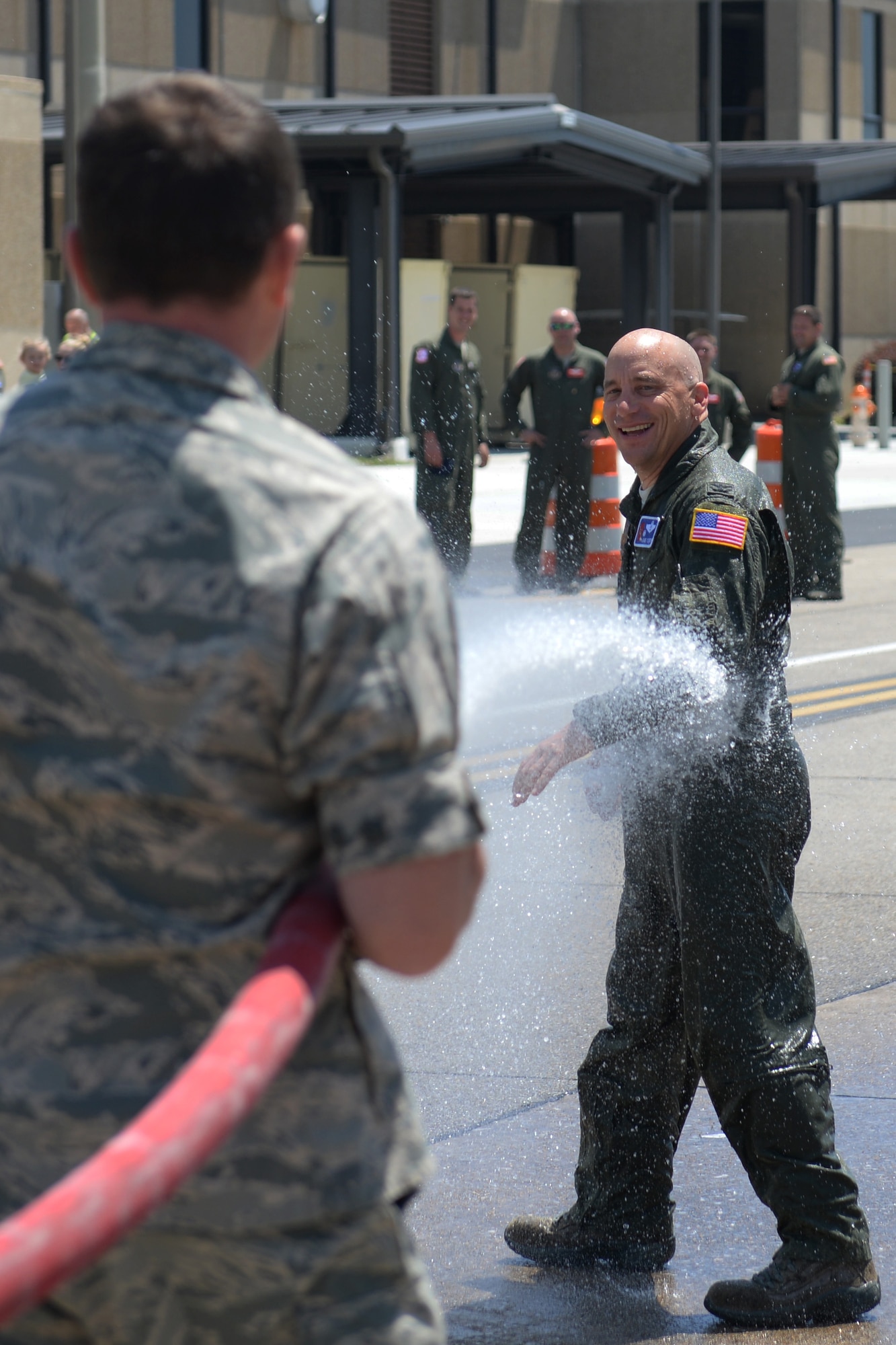 Col. David Condit, 403rd Operation Group commander, is sprayed by Maj. Kevin Myers, 403rd OG executive officer, in celebration of his final flight with the 403rd Wing May 5, 2016, Keesler Air Force Base, Mississippi. Condit has been assigned to the 403rd Wing since July 2013 and has more than 4,000 flight hours throughout his career in the Air Force. His last day with the 403rd Wing is May 15, 2016. His next assignment is as the 908th Airlift Wing commander at Maxwell Air Force Base, Alabama. (Air Force photo/Airman 1st Class Travis Beihl)
