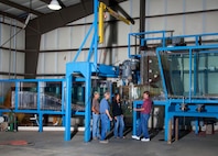 Researchers collect hydraulic data from a scale model of the new Ice Harbor Dam turbine at the U.S. Army Corps of Engineers' Engineering Research and Development Center in Vicksburg, Mississippi. The turbine model is about 1 foot wide; the actual turbine is about 23 feet in diameter.