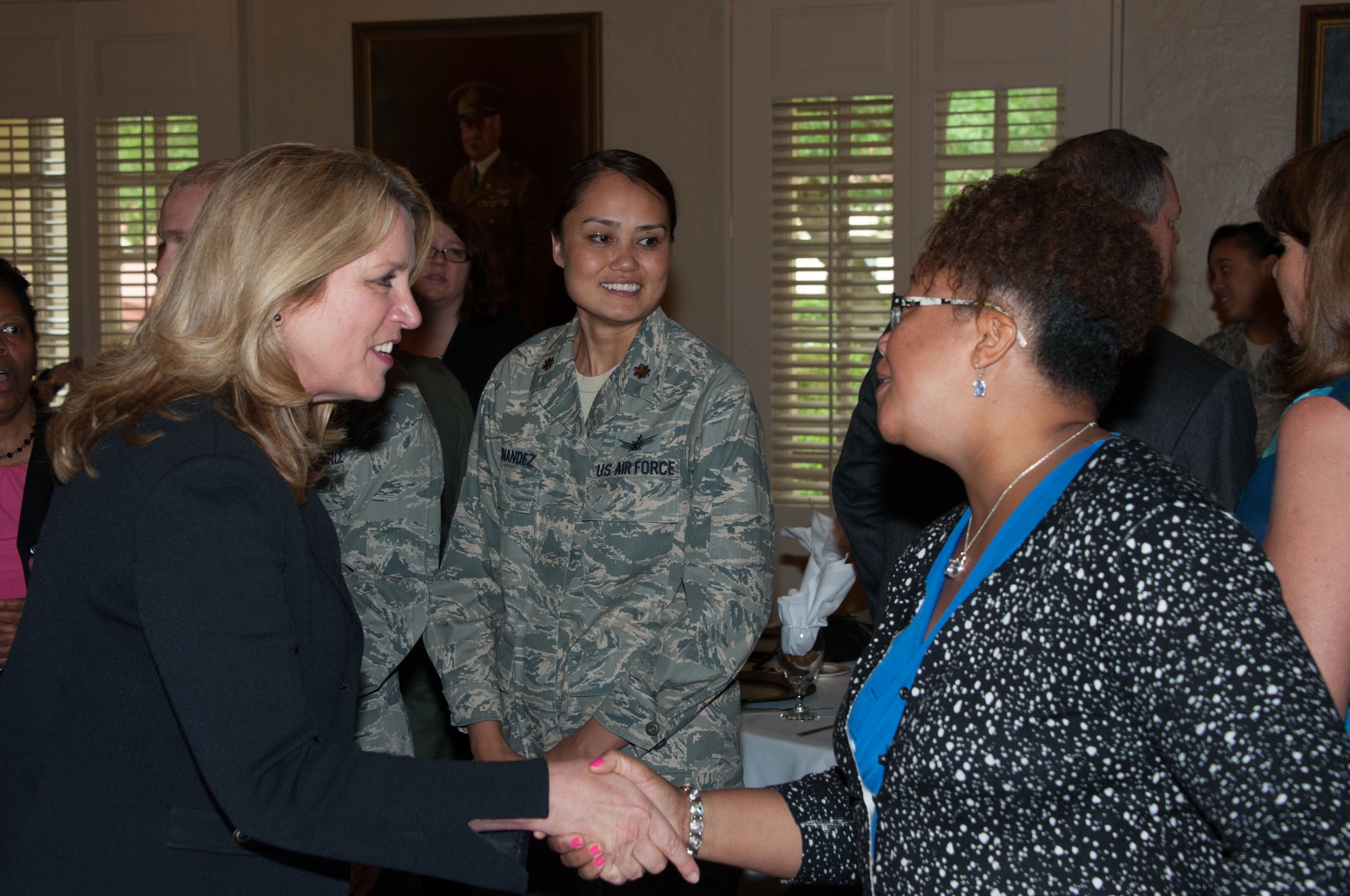 Secretary of the Air Force Deborah Lee James takes time to meet and greet with the attendees after the Women in Leadership Luncheon, May 3, 2016, Maxwell Air Force Base, Ala. The event brought women and men from across the base to discuss issues directly facing women in the military and James shed some light on the new policies that will help mitigate those issues. (U.S. Air Force photo/ Bud Hancock)