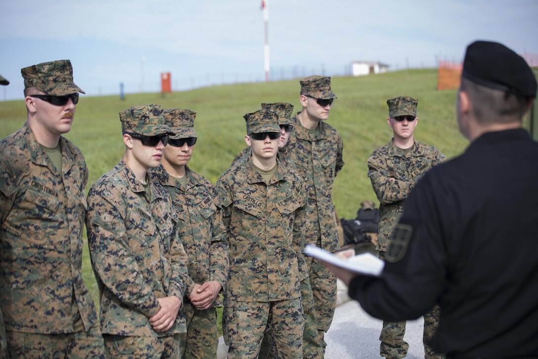 Warrant Officer Branislav Banovacki, a counter terrorism military police technician with Special Brigade, Serbian Armed Forces, shows Marines how to conduct a search for IEDs in a car during exercise Platinum Wolf 2016 at Peacekeeping Training Operations Center South Base in Bujanovac, Serbia, May 10, 2016. Reserve Marines with 4th Law Enforcement Battalion, Force Headquarters Group, Marine Forces Reserve join six other partner nations to conduct classes on peacekeeping operations and non-lethal weapons systems. (U.S. Marine Corps photo by Sgt. Sara Graham)