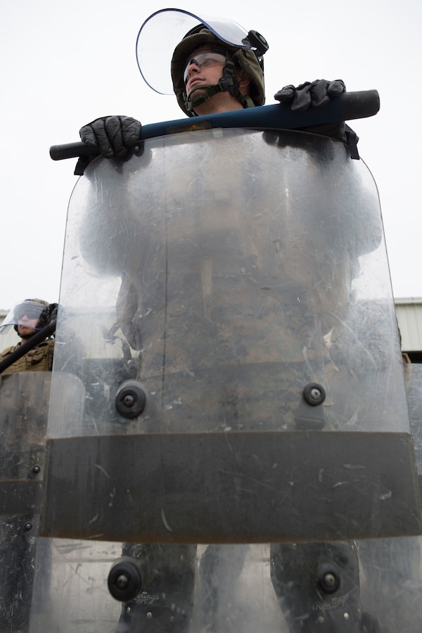 Pfc. Tanner Haug, a military policeman with 4th Law Enforcement Battalion, Forces Headquarters Group, Marine Forces Reserve, listens to a class on crowd control during exercise Platinum Wolf 2016 at Peacekeeping Training Operations Center South Base in Bujanovac, Serbia, May 12, 2016. Platinum Wolf brings together service members from Bosnia, Bulgaria, Macedonia, Montenegro, Serbia, Slovenia, and the United States to train in peacekeeping operations and non-lethal weapons capabilities. (U.S. Marine Corps photo by Sgt. Sara Graham)