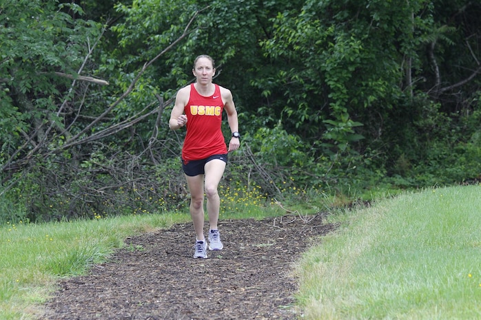 Capt. Christine Taranto, logistics analyst with Marine Corps Systems Command’s Acquisition Logistics and Product Support, trains on trails at Marine Corps Base Quantico, Virginia. Taranto, an active triathlete and marathoner, was recognized on May 11 as the Marine Corps 2015 Female Athlete of the Year. (U.S. Marine Corps photo by Mathuel Browne)