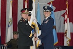 U.S. Air Force Gen. Lori J. Robinson receives the North American Aerospace Defense Command guidon from the Canadian Chief of Defence Staff, Gen. J.H. Vance signifying her acceptance of command, May 13, 2016 on Peterson Air Force Base, Colo. Gen. Robinson is the 24th NORAD commander. 