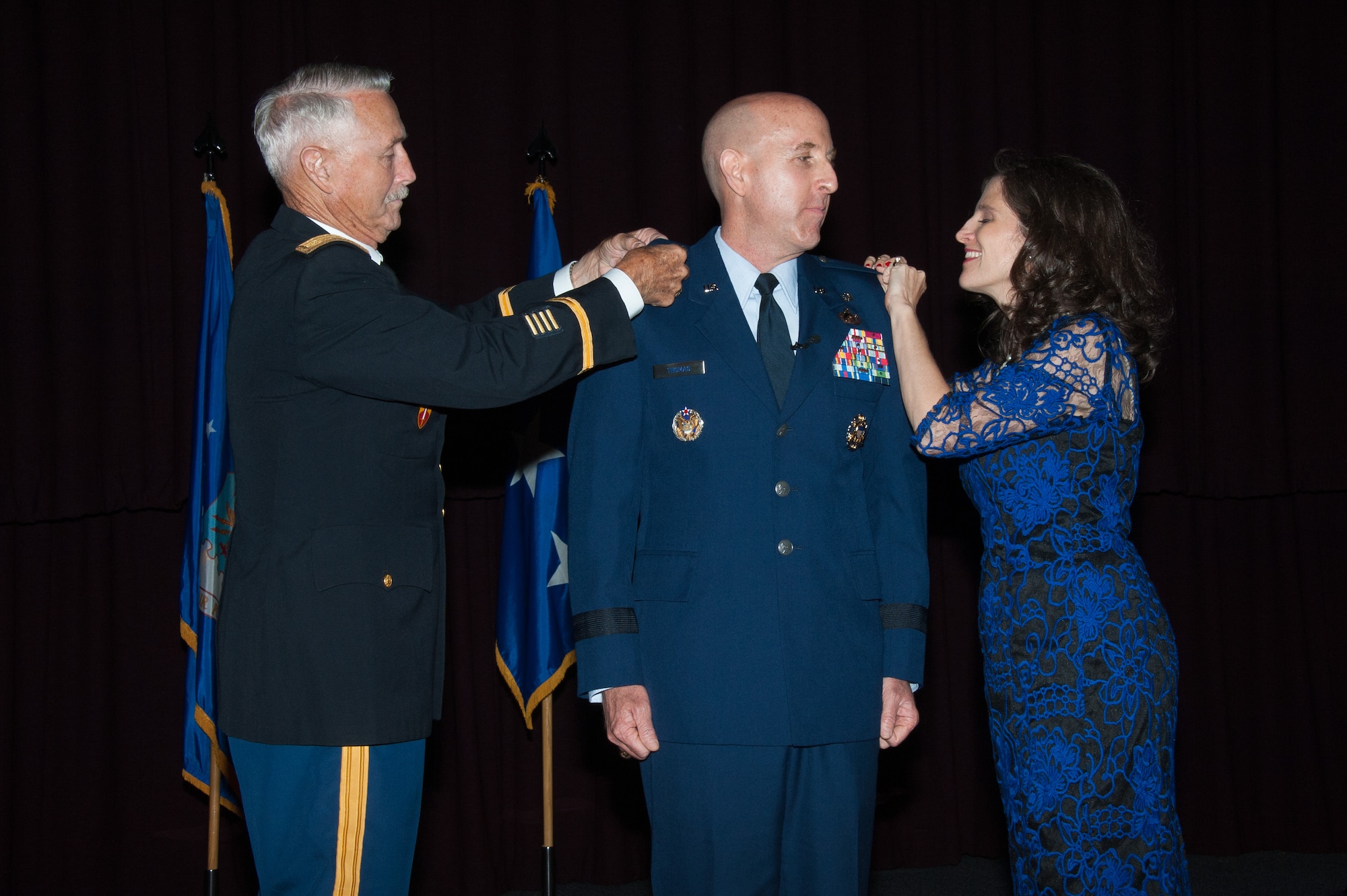 Brig. Gen. Edward W. Thomas Jr. is pinned by his father, Retired Army Maj. Edward W. Thomas, Sr. and Gen. Thomas’ wife, Dinah during his promotion ceremony at the Non Commissioned Officer Academy, Maxwell Air Force Base, May 12, 2016.  Thomas is only one of two career Public Affairs flag officers. (US Air Force photo by Melanie Rodgers Cox) 