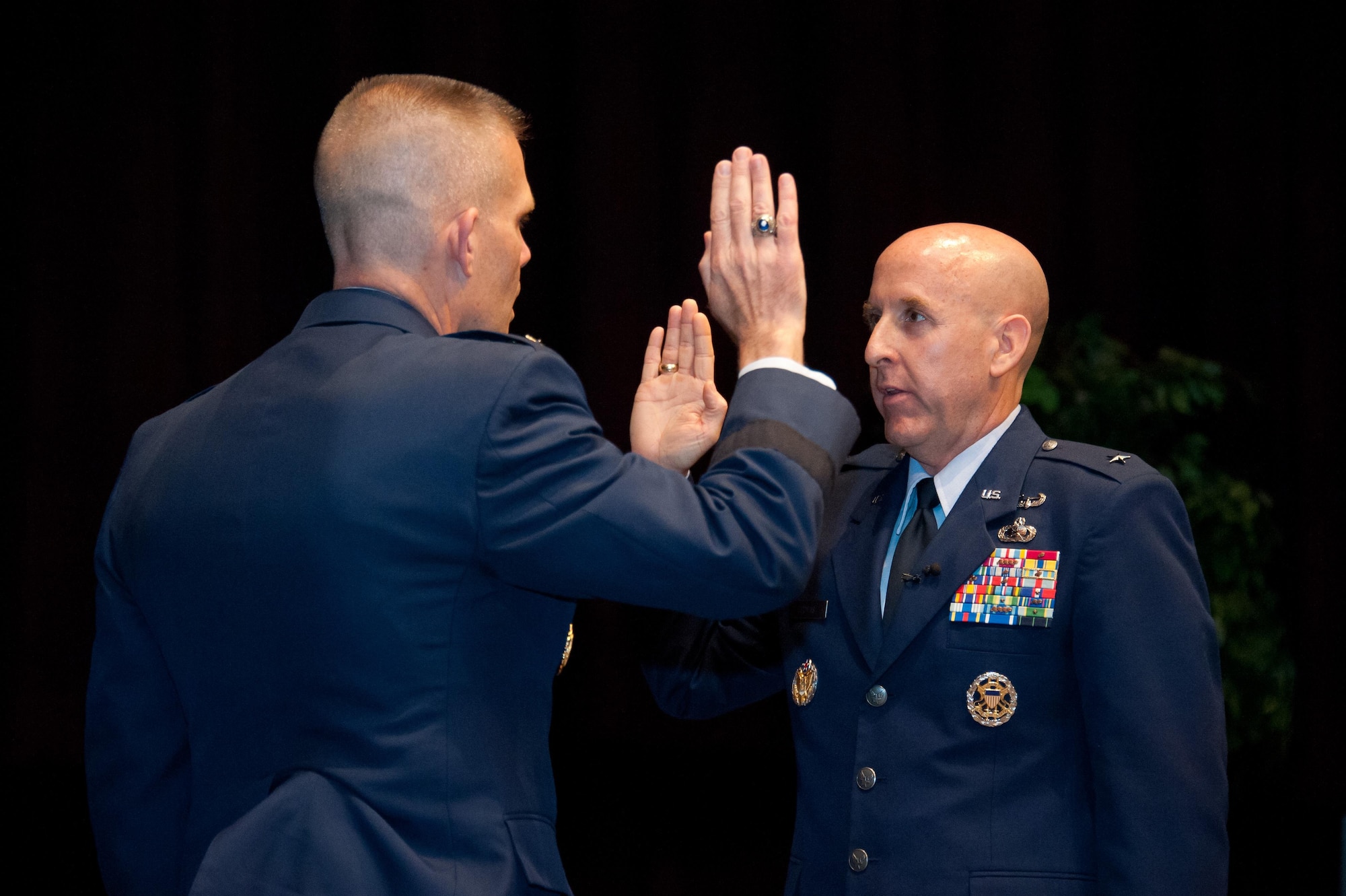 Lt. Gen. Steven Kwast, commander Air University administers the oath of office to Brig. Gen. Edward Thomas in the Non Commissioned Officer Academy at Maxwell Air Force Base, May 12, 2016.  Thomas is the commander of the Thomas N. Barnes Center for Enlisted Education. (US Air Force photo by Melanie Rodgers Cox) 