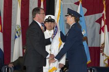 U.S. Air Force Gen. Lori J. Robinson receives the U.S. Northern Command guidon from the U.S. Secretary of Defense, Ashton B. Carter signifying her acceptance of command, May 13, 2016 on Peterson Air Force Base, Colo. Gen. Robinson is the seventh commander of USNORTHCOM since its inception on Oct 1, 2002. 