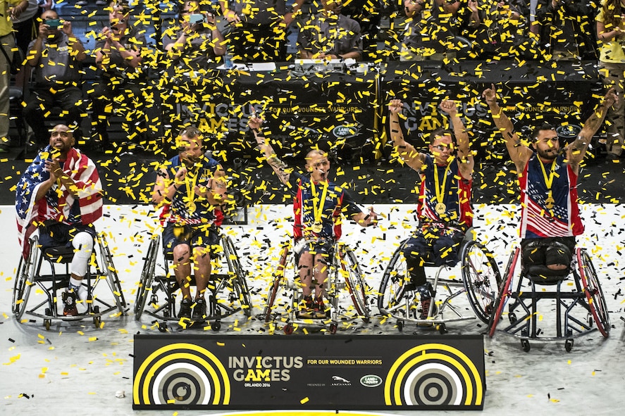 U.S. wheelchair basketball team members celebrate their gold medal win during the 2016 Invictus Games.