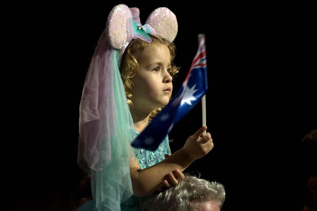 A young girl waves the Australian flag during the closing ceremony at the 2016 Invictus Games in Orlando, Fla. May 12, 2016. DoD photo by E. Joseph Hersom