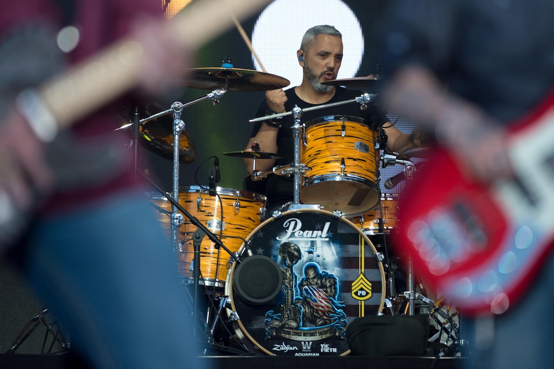Retired Army Staff Sgt. Paul Delacerda plays drums for Vetted, a band made up of wounded warriors at the closing ceremony of the 2016 Invictus Games in Orlando, Fla. May 12, 2016. DoD photo by E. Joseph Hersom
