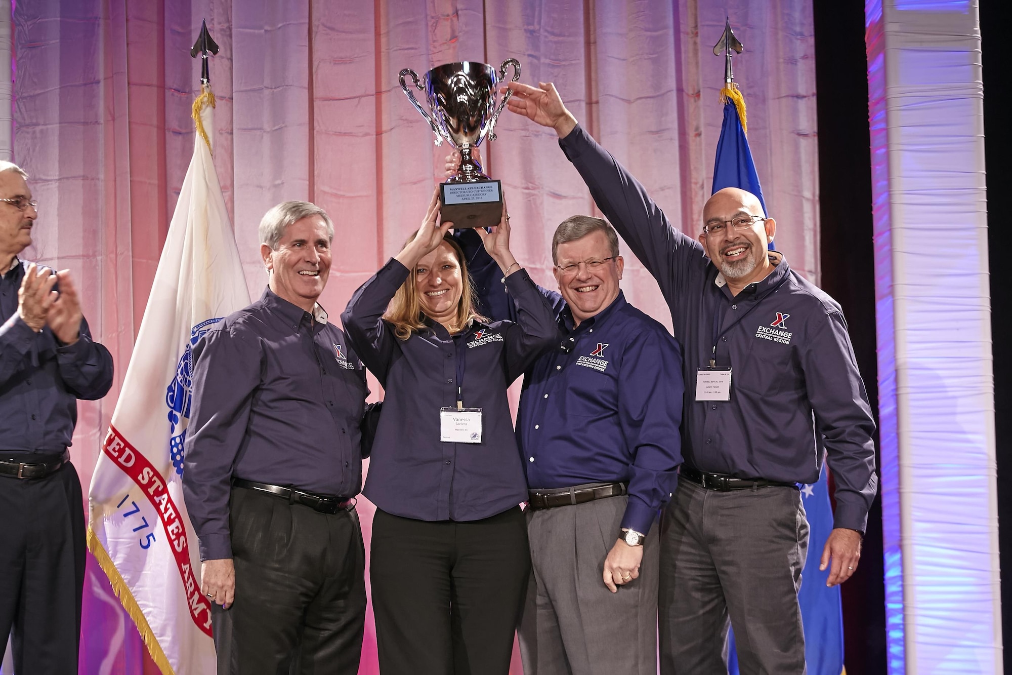 Army & Air Force Exchange Service leadership awards the coveted Director/CEO Cup to the management team of the Maxwell Air Force Base Exchange at Main Store Managers/General Managers Conference, April 25, 2016, in Frisco, Texas. From left; Mike Immler, deputy director; Michael Howard, chief operating officer, Vanessa Saelens, Maxwell AFB Exchange main store manager; Tom Shull, director/CEO; and Lorenzo Salgado, general manager of the Maxwell AFB Exchange.