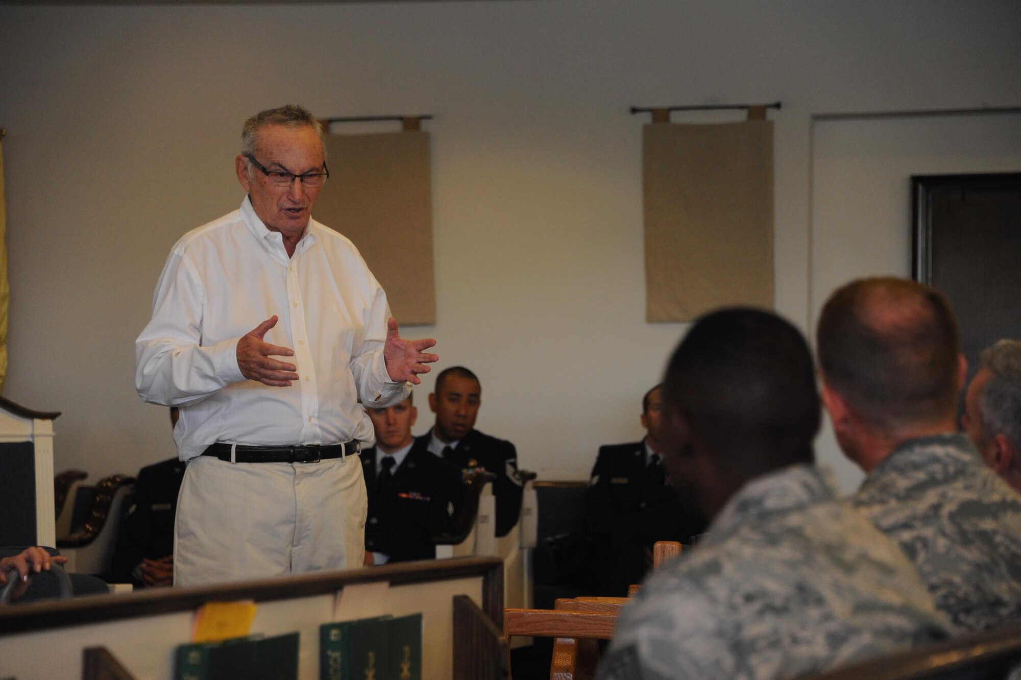 Sidney Finkel, Holocaust survivor, speaks to an audience of airmen during the Holocaust Day of Remembrance at Davis-Monthan Air Force Base, Ariz., May 9, 2016. Eight Holocaust survivors spoke to Airmen and family members about their personal accounts of survival during the holocaust. (U.S. Air Force photo by Airman Nathan H. Barbour)