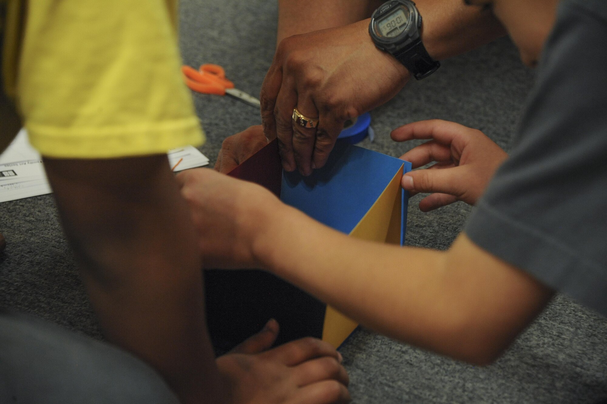 U.S. Air Force Tech. Sgt. Cruz Cardenas, 355th Logistics Readiness Squadron, and his sons build a sculpture during Month of the Military Child Family Art Series: Creative Explorations for Hope at the University of Arizona Museum of Art in Tucson, Ariz., April 30, 2016. The families created art during their guided tours at the UAMA. (U.S. Air Force photo by Airman 1st Class Mya M. Crosby/Released)