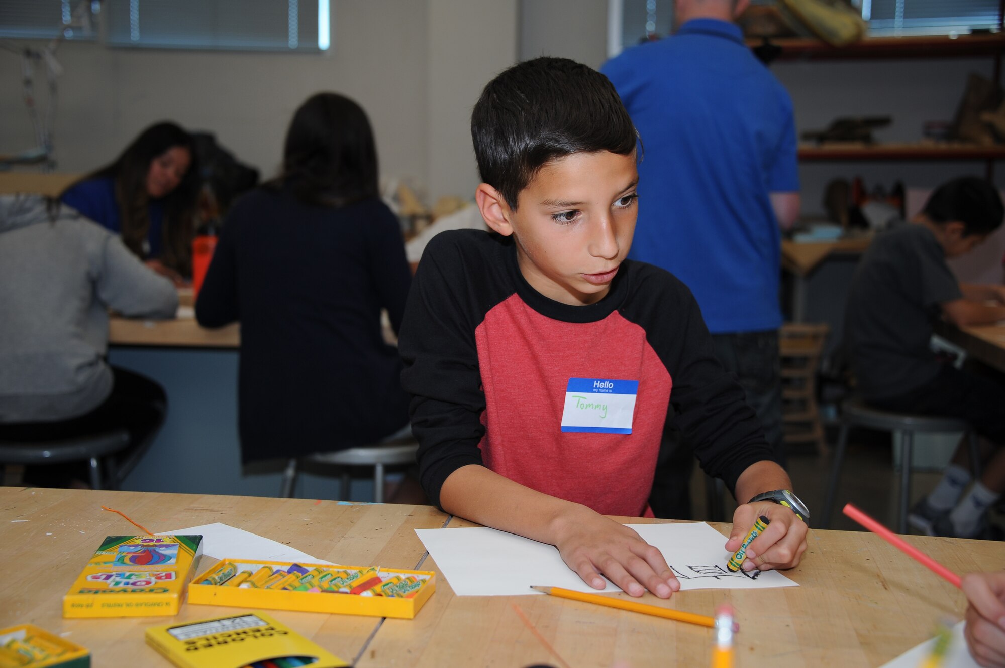 Tommy Duncan, creates art during Month of the Military Child Family Art Series at the University of Arizona Museum of Art: Creative Explorations for Hope in Tucson, Ariz., April 30, 2016. The series invited all branches of active duty military families to participate in touring exhibitions and attending art tutorials free of charge. The museum will be displaying artworks created by the military families August 13 to October 2. (U.S. Air Force photo by Airman 1st Class Mya M. Crosby/Released)