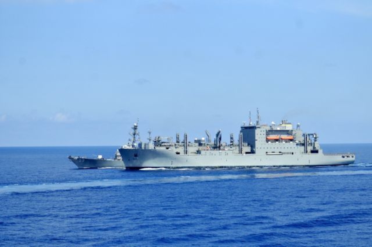 The guided-missile destroyer USS Russell conducts a replenishment at sea with the dry cargo and ammunition ship USNS Charles Drew in the South China Sea, March 10, 2016. Navy photo by Chief Petty officer Ja'lon A. Rhinehart