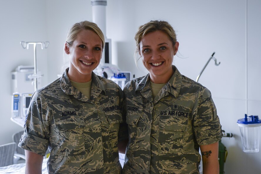 Staff Sgt. Rebekah Adams (left), 99th Inpatient Operations Squadron critical care technician, and 1st Lt. Elizabeth Cassidy (right), 99th Surgical Operations Squadron Post Anesthesia Care Unit nurse, pose for a picture at the Mike O’Callaghan Federal Medical Center at Nellis Air Force Base, Nev., April 28. On May 6 Nellis AFB began a week-long celebration for Nurse and Medical Technician Appreciation Week to recognize the contributions nurses and technicians make to healthcare. (U.S. Air Force photo by Airman 1st Class Nathan Byrnes)