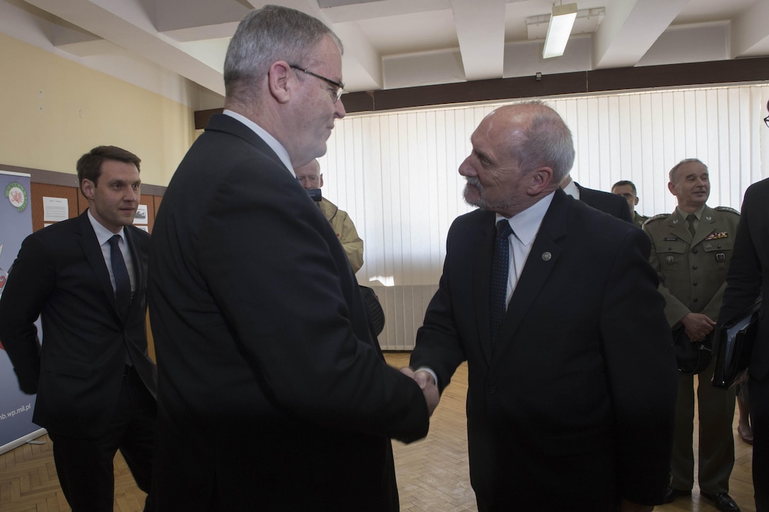 Deputy Defense Secretary Bob Work exchanges greetings with Polish Defense Minister Antoni Macierewicz in Redzikowo, Poland, May 13, 2016. DoD photo by Navy Petty Officer 1st Class Tim D. Godbee