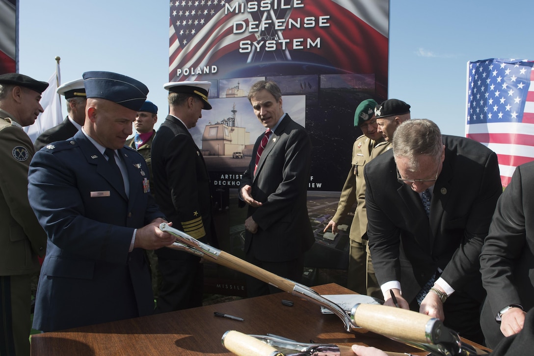 Deputy Defense Secretary Bob Work signs a ceremonial shovel at the Aegis Ashore ballistic missile defense site phase three groundbreaking ceremony in Redzikowo, Poland, May 13, 2016. DoD photo by Navy Petty Officer 1st Class Tim D. Godbee