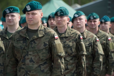 Polish troops stand in formation during the Aegis Ashore ballistic missile defense site phase three groundbreaking ceremony
