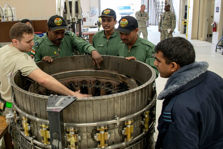 A U.S. Air Force propulsion airman with the 354th Maintenance Squadron provides an overview of an F-16 engine here, May 10, 2016.(U.S. Air Force photo by Staff Sgt. Ashley Taylor)