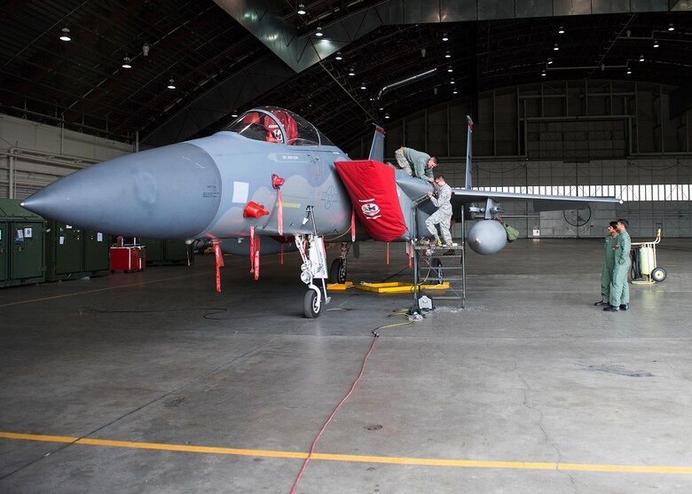 Maintainers with the 67th Maintenance Squadron, 67th Fighter Squadron, Kadena Air Base, Japan, and the Indian Air Force look over an F-15C Eagle as a cooperative effort to familiarize and learn about specific maintenance challenges experienced by each service. (U.S. Air Force photo by Staff Sgt. Shawn Nickel)