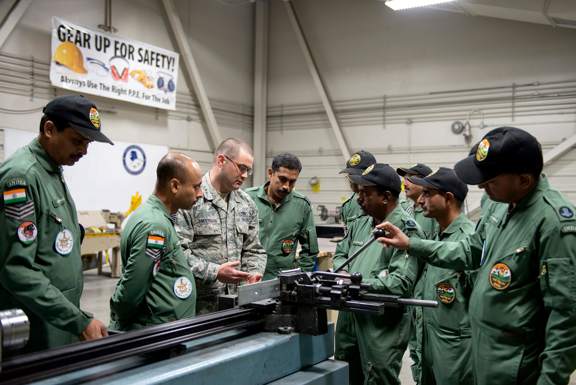 U.S. Air Force Technical Sergeant James Anderson, 354th Maintenance Squadron, provides insight into sheet metal operations to Airman with the Indian Air Force, here, May 10, 2016. (U.S. Air Force photo by Staff Sgt. Ashley Taylor)