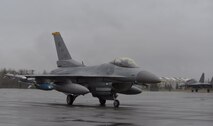 A U.S. Air Force F-16 Fighting Falcon pilot assigned to the 80th Fighter Squadron out of Kunsan Air Base, Republic of Korea, taxis down the Eielson Air Force Base, Alaska, flight line with an Indian air force Su-30 MKI aircraft, May 3, 2016, in preparation for a RED FLAG-Alaska (RF-A) 16-1 afternoon mission. The Joint Pacific Alaska Range Complex provides units like the Wolf Pack access to a realistic training environment and allows commanders to train for full spectrum engagements ranging from individual skills to complex, large-scale joint engagements, enabling joint and international units to exchange tactics, techniques and procedures while improving interoperability in a realistic threat environment. (U.S. Air Force photo by Master Sgt. Karen J. Tomasik/Released)