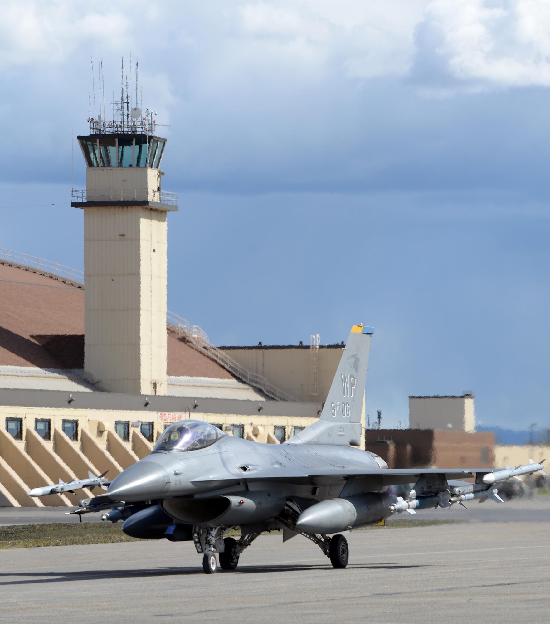 A U.S. Air Force F-16 Fighting Falcon pilot assigned to the 80th Fighter Squadron out of Kunsan Air Base, Republic of Korea, taxis down the Eielson Air Force Base, Alaska, flight line in a jet painted with the 8th Operations Group markings, May 4, 2016, in preparation for a RED FLAG-Alaska (RF-A) 16-1 afternoon mission. Wolf Pack pilots can sharpen their combat skills in the Joint Pacific Alaska Range Complex, which provides more than 67,000 square miles of airspace, one conventional bombing range and two tactical bombing ranges containing 510 different types of targets and 45 threat simulators, both manned and unmanned. (U.S. Air Force photo by Master Sgt. Karen J. Tomasik/Released)
